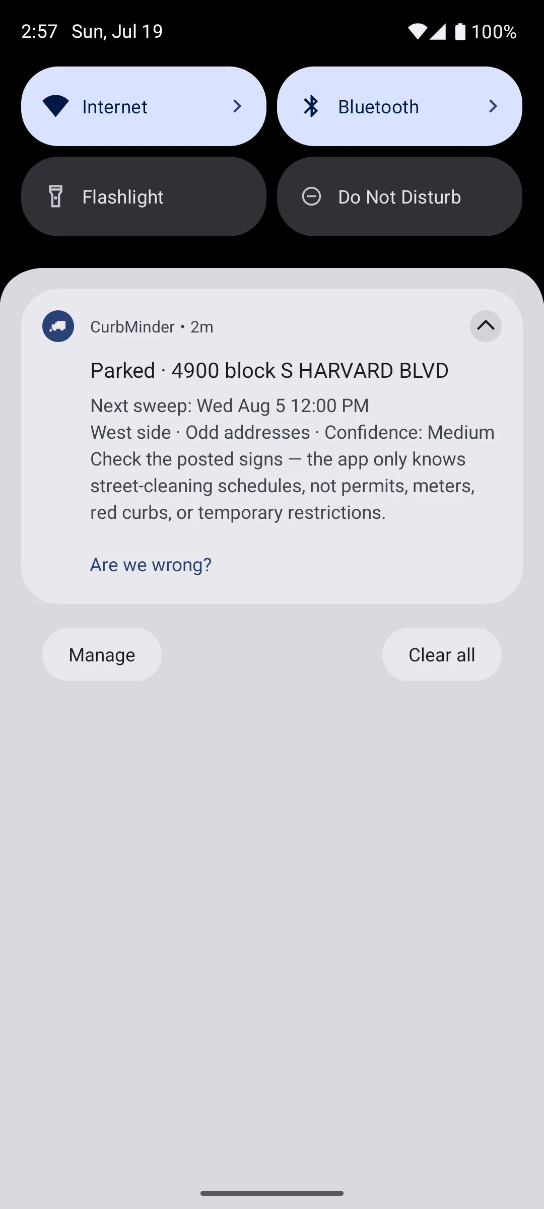 CurbMinder reminder on the lock screen showing time remaining until street sweeping